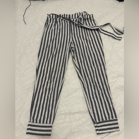 Blue and white striped linen pants with a paper bag waist and belt. - Picture 1 of 5